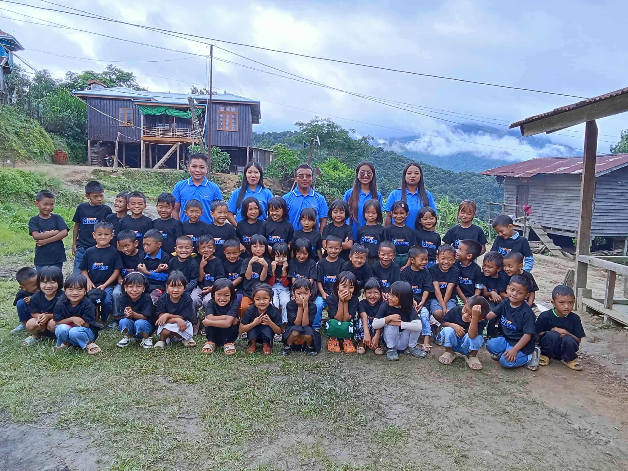 Students and staff at Zephai Primary School in Chin State, with mountains in the background